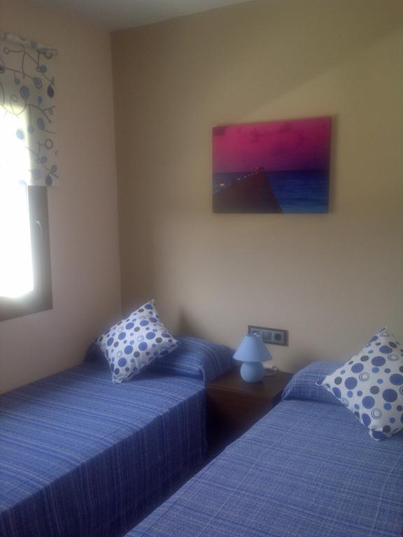 Apartamentos Es Calo Pokoj fotografie